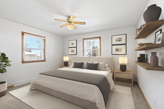 90 Lake St, Oshkosh, WI 54901 - bedroom with a ceiling fan, baseboards, light colored carpet, and a baseboard radiator
