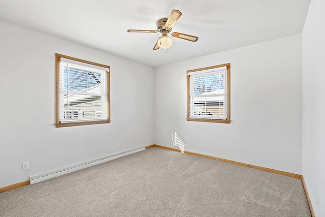 90 Lake St, Oshkosh, WI 54901 - spare room featuring baseboards, a ceiling fan, a baseboard heating unit, and light carpet