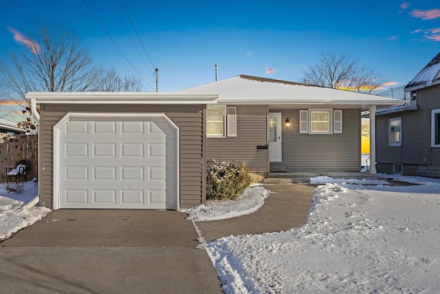 90 Lake St, Oshkosh, WI 54901 - ranch-style house featuring entry steps, an attached garage, and driveway