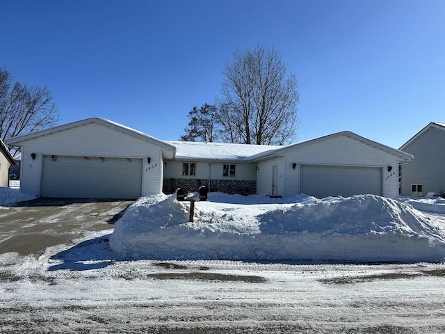 ranch-style home featuring a garage