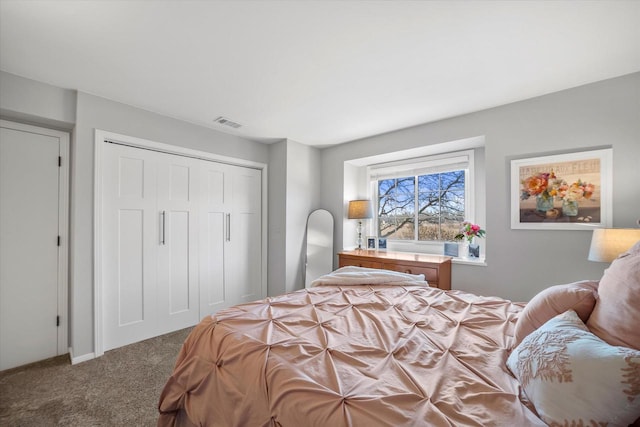 carpeted bedroom with a closet