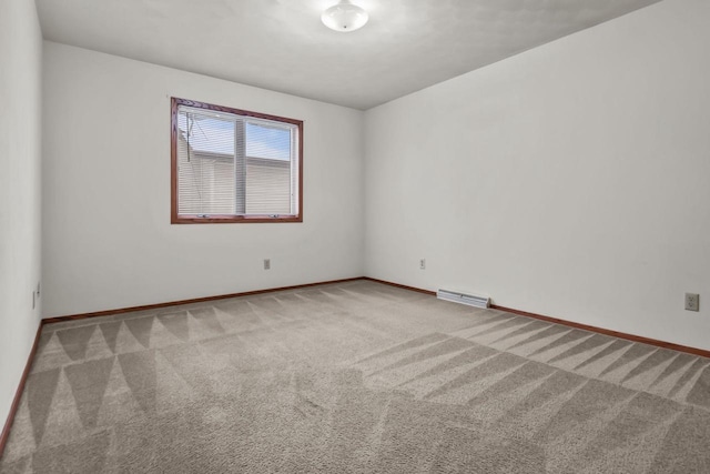 spare room with light carpet