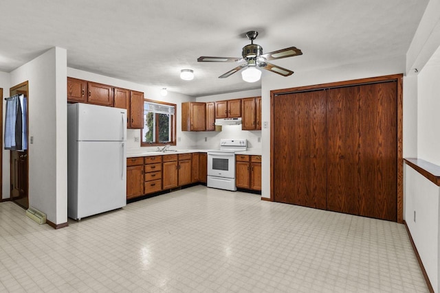 kitchen with ceiling fan, white appliances, and sink