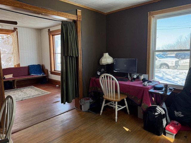 office with crown molding, baseboards, and wood finished floors