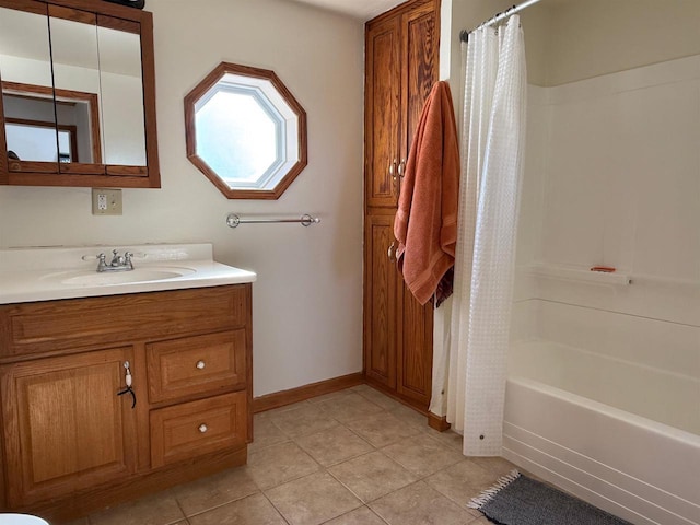 full bath with baseboards, shower / tub combo, vanity, and tile patterned floors