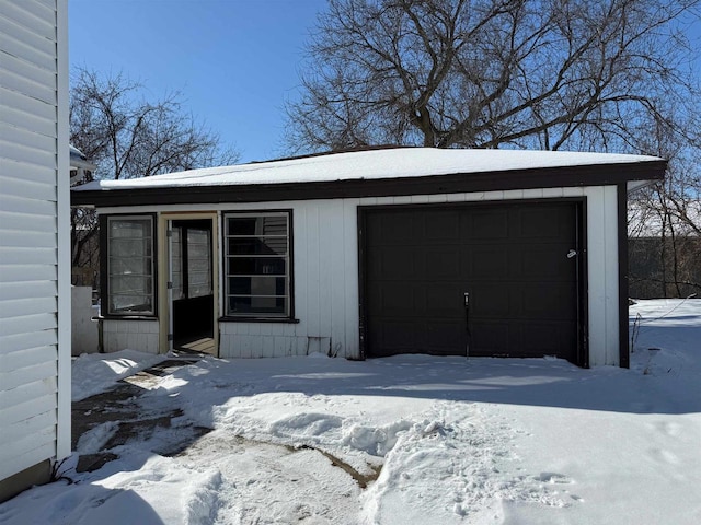 view of snow covered garage