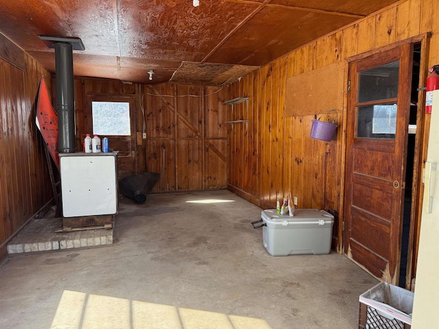 below grade area with a wood stove and wooden walls