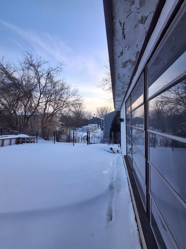 view of yard layered in snow