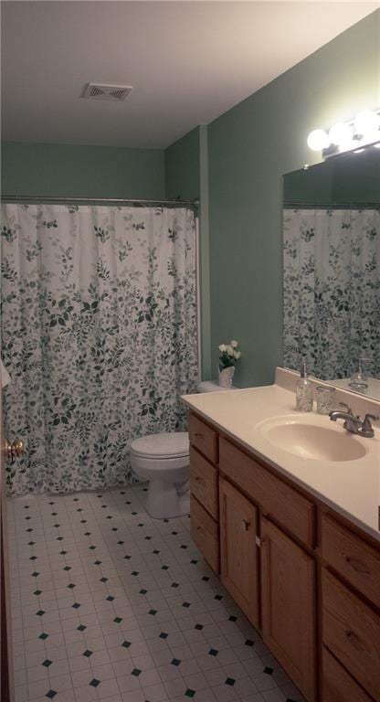 full bath featuring toilet, visible vents, and vanity