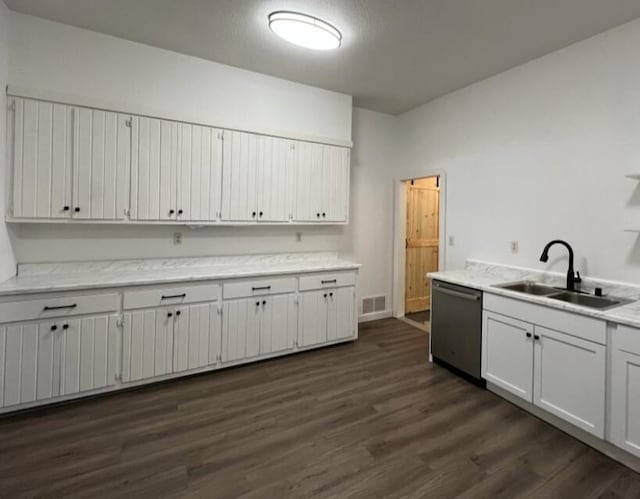 kitchen featuring white cabinetry, dark wood-type flooring, dishwasher, and sink