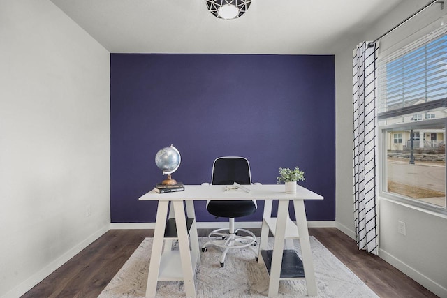 home office featuring baseboards and wood finished floors