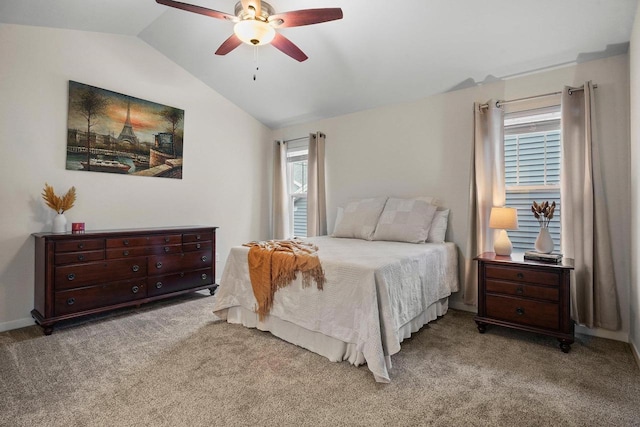 bedroom featuring lofted ceiling, a ceiling fan, and light colored carpet