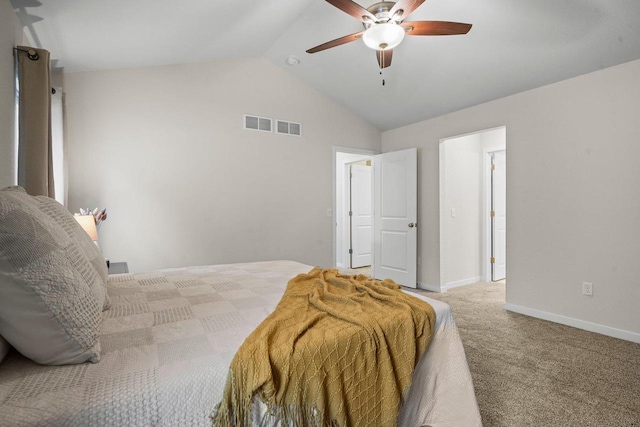 bedroom featuring visible vents, vaulted ceiling, light carpet, and baseboards