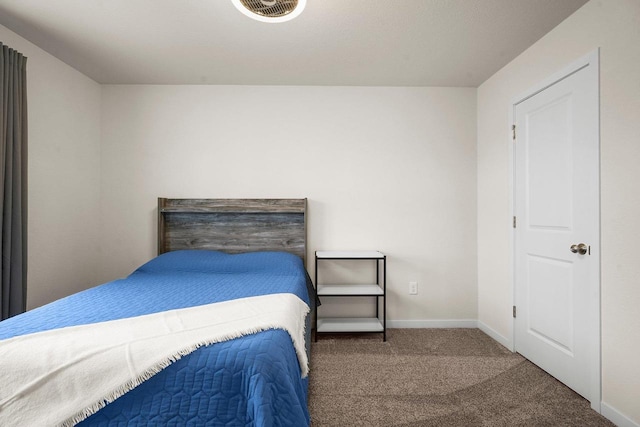 carpeted bedroom with baseboards and visible vents