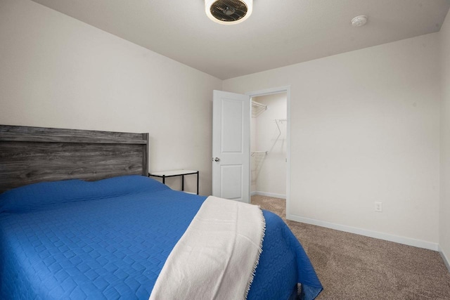 carpeted bedroom with baseboards