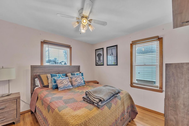 bedroom featuring light hardwood / wood-style flooring and ceiling fan