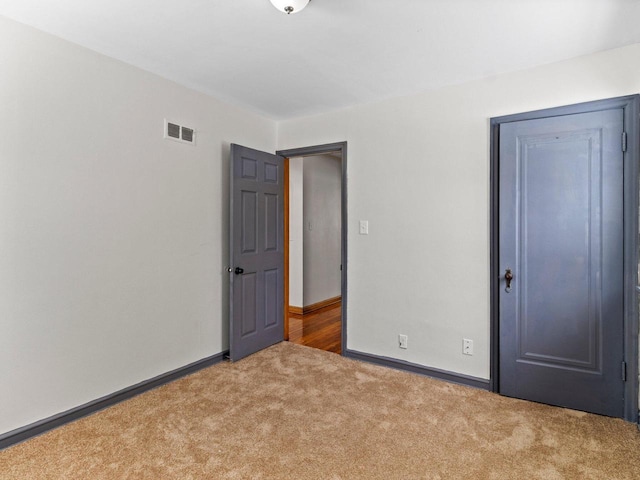 unfurnished bedroom featuring carpet flooring