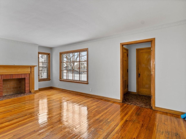 unfurnished living room featuring a fireplace and light hardwood / wood-style flooring