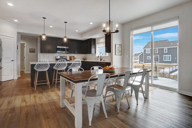 dining room featuring recessed lighting, baseboards, and wood finished floors