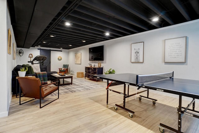 game room with light wood-style flooring