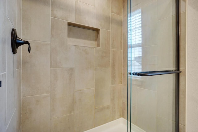 bathroom featuring a shower stall