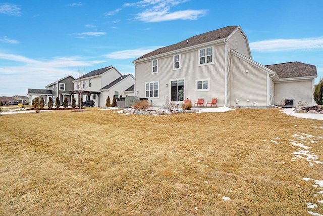 rear view of house featuring a residential view, a lawn, a pergola, and a patio