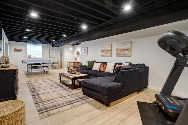 living room featuring light wood-type flooring and baseboards