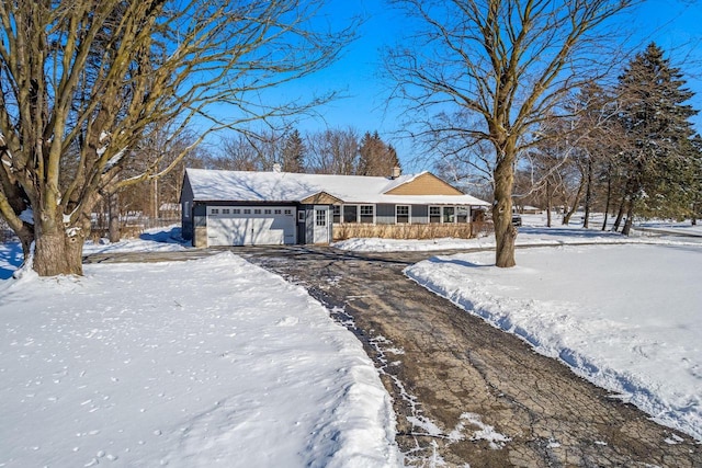 ranch-style home with a garage