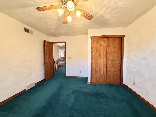 414 S Wisconsin St, Mineral Point, WI 53565 - unfurnished bedroom featuring baseboards, carpet, visible vents, and a ceiling fan