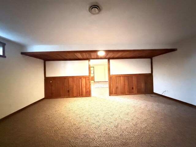 414 S Wisconsin St, Mineral Point, WI 53565 - finished below grade area featuring carpet, a wainscoted wall, and wooden walls