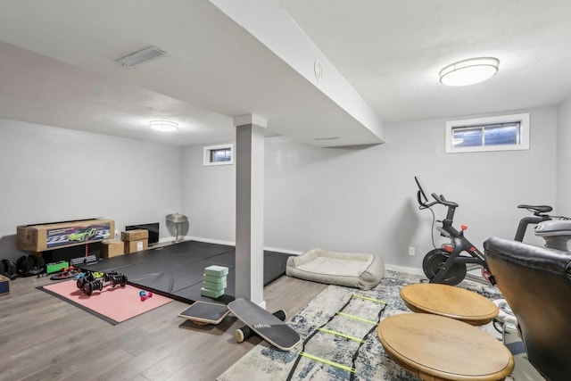 workout room with wood-type flooring