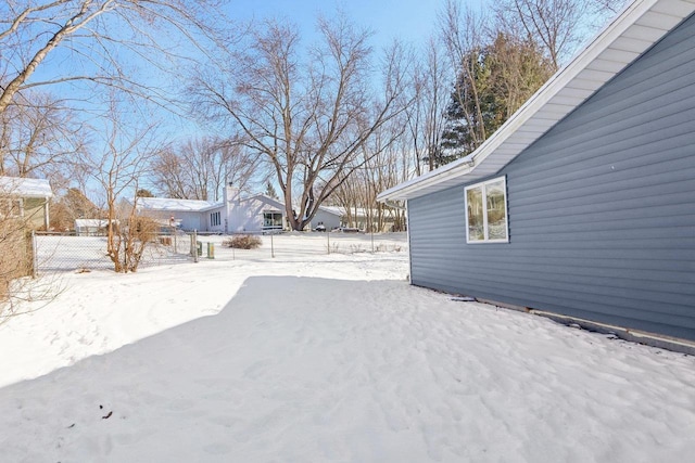 view of yard covered in snow