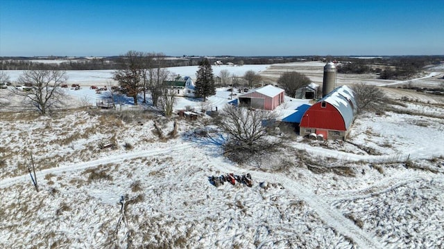 snowy aerial view featuring a rural view