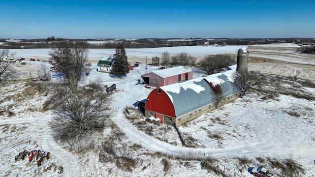 snowy aerial view featuring a rural view