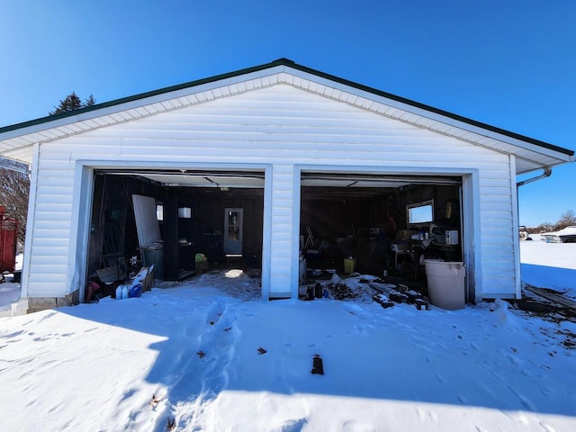 view of snow covered garage