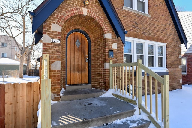 view of snow covered property entrance