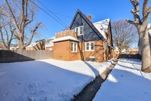 snow covered house with a balcony