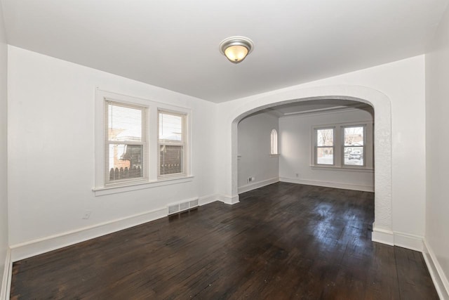 spare room with dark hardwood / wood-style flooring