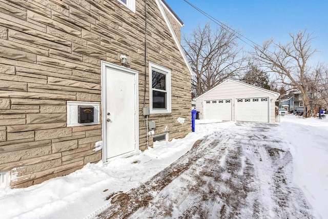 exterior space with a garage and an outdoor structure