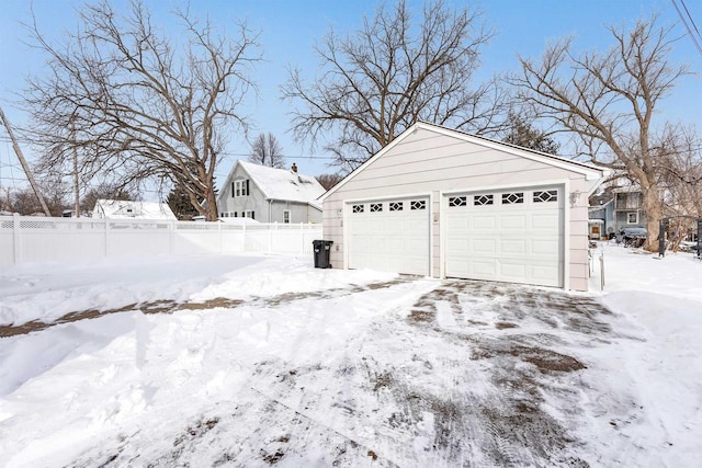 view of snow covered garage