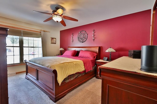 carpeted bedroom featuring ceiling fan