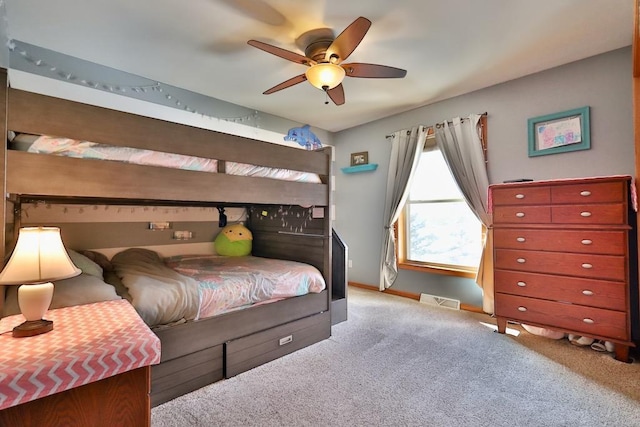 bedroom with ceiling fan and light carpet