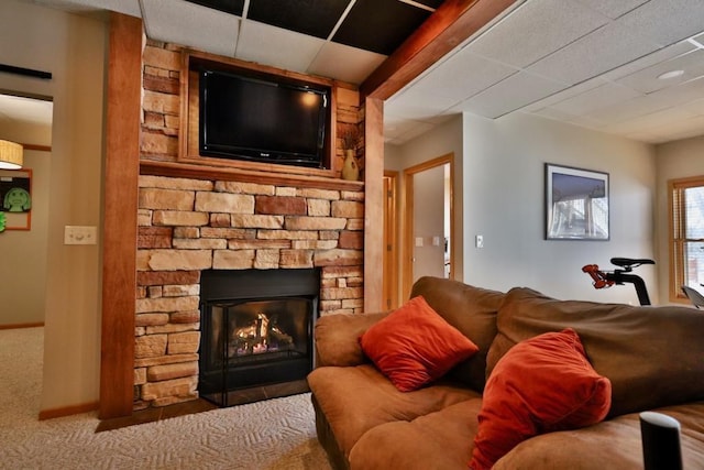 carpeted living room featuring a fireplace