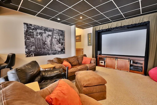 home theater featuring a drop ceiling and carpet floors