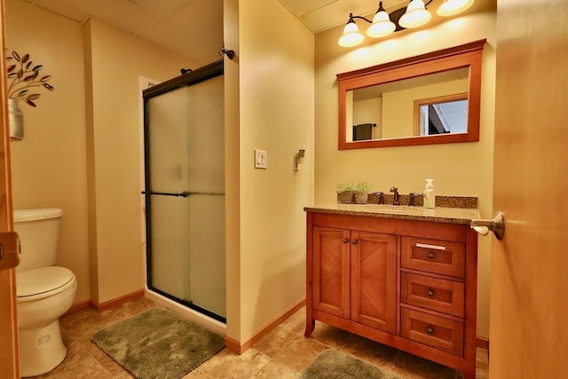 bathroom with toilet, tile patterned flooring, vanity, and a shower with door