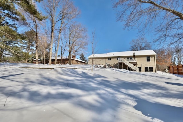 view of snow covered house