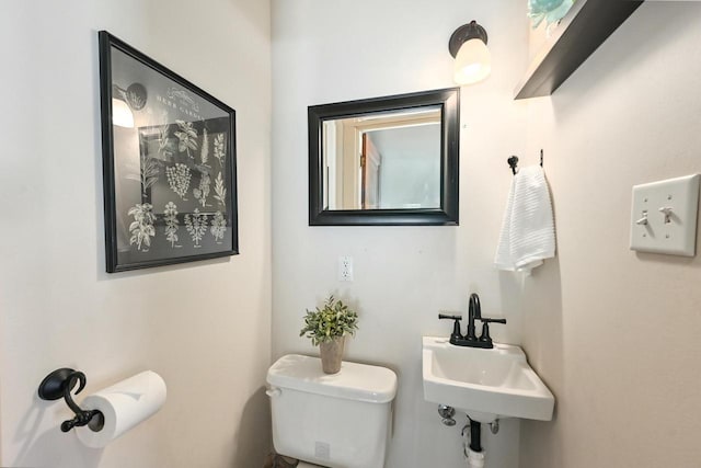 bathroom featuring sink and toilet