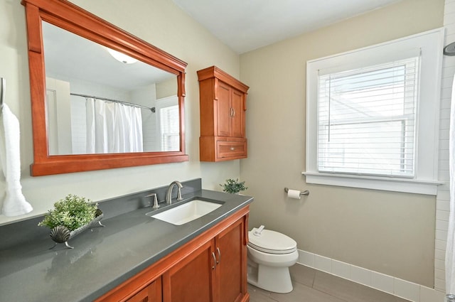 bathroom featuring a shower with curtain, toilet, tile patterned flooring, and vanity