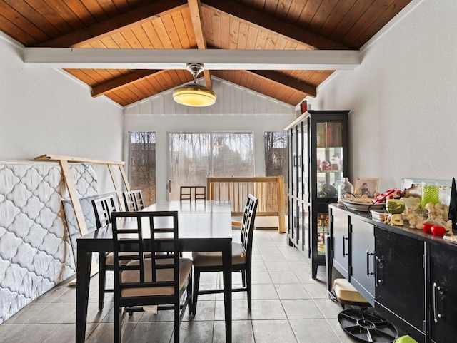 dining space featuring wood ceiling, vaulted ceiling with beams, and light tile patterned floors