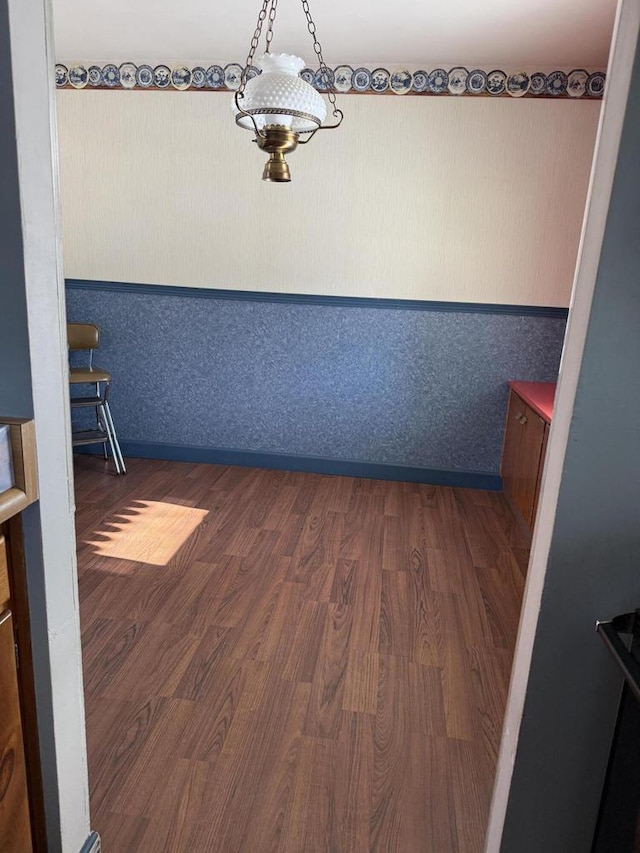 spare room featuring dark wood-type flooring